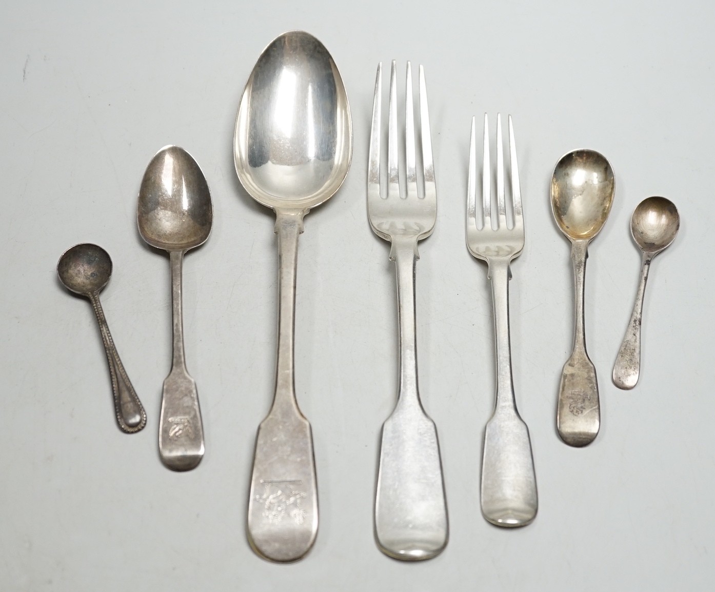 A set of six Victorian silver fiddle pattern tablespoons, William Eaton, London, 1841, a set of six similar table forks, London, 1838 and a quantity of assorted 19th century and later silver cutlery, various dates and ma